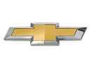 The image shows the Chevrolet logo, which is a gold bowtie emblem with a silver outline on a black background.